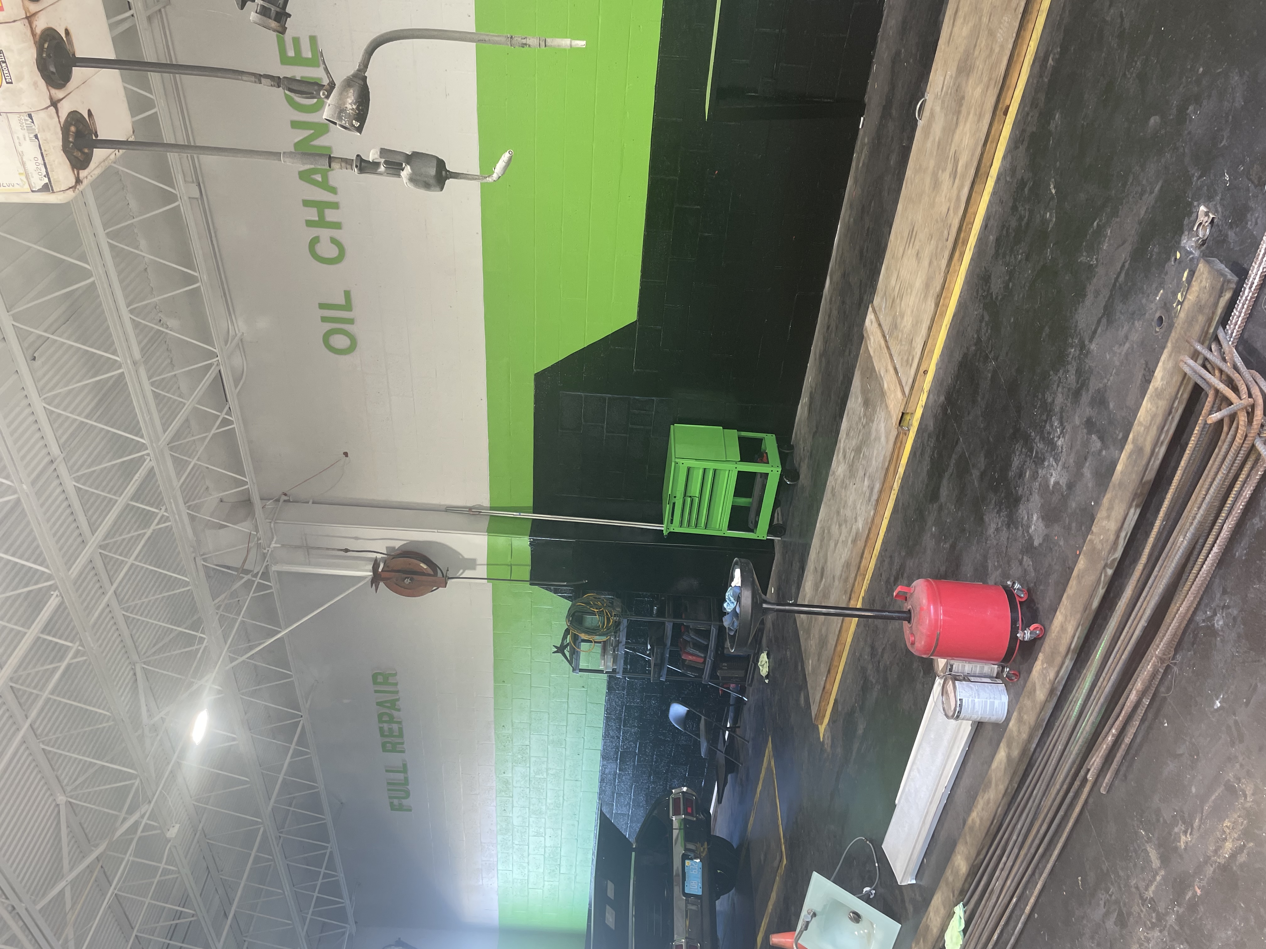Auto repair shop with green and black walls